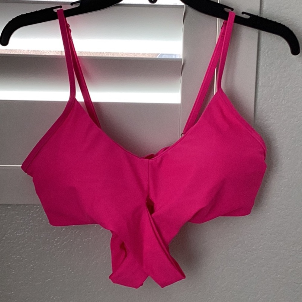 Women's swim top that slips on over the head with additional tie below. NWOT